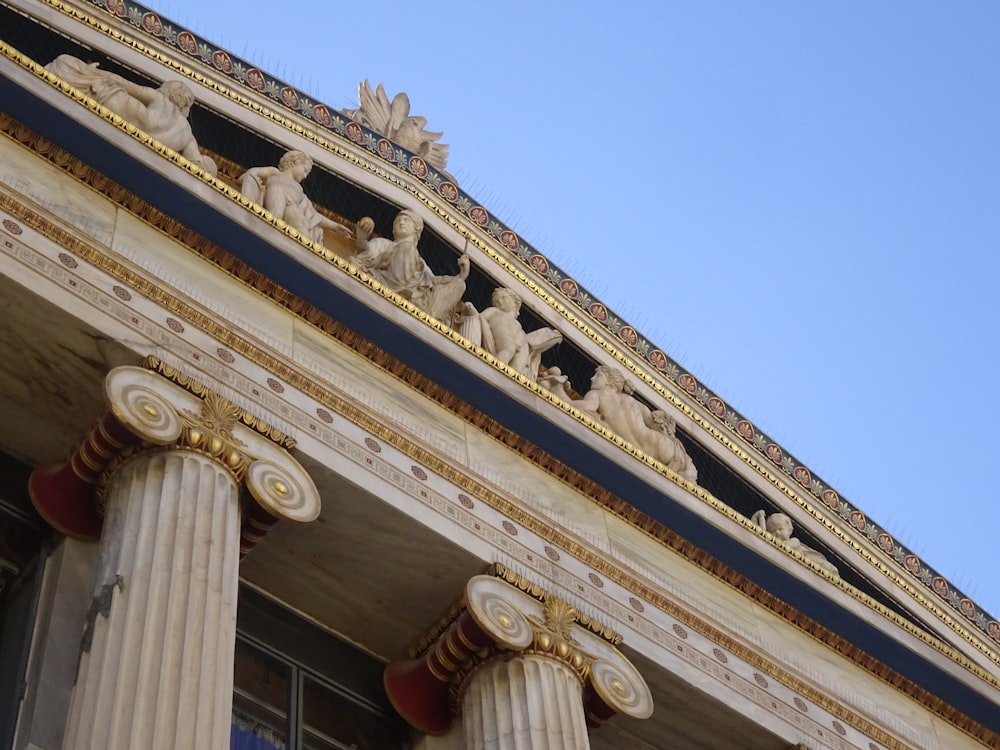 a close up of the top of a building with columns