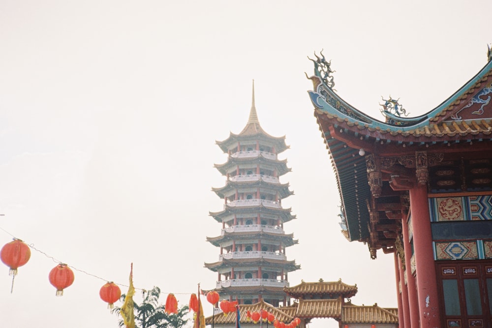 a tall building with a tall tower in the background