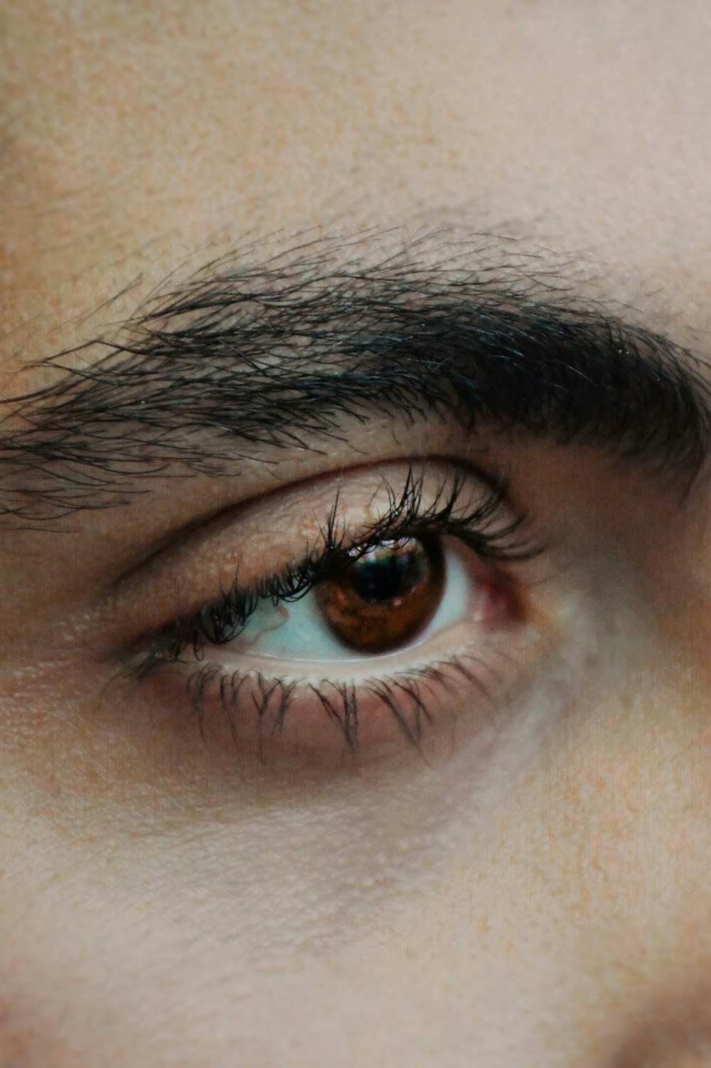 a close up of a person's eye with long lashes