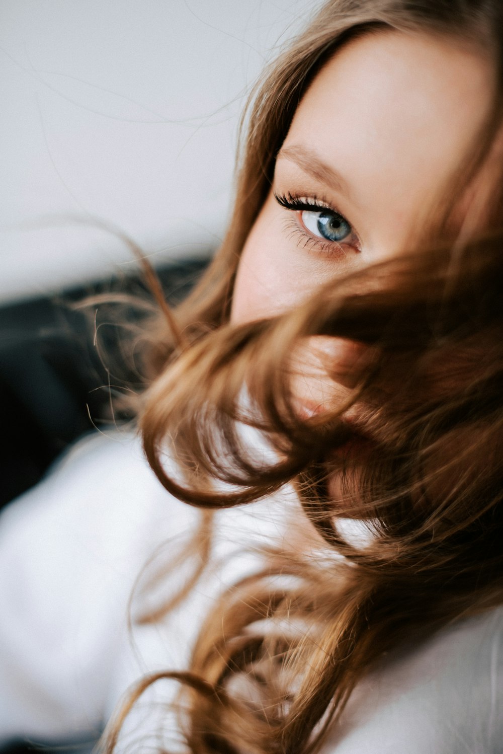 a close up of a person with long hair