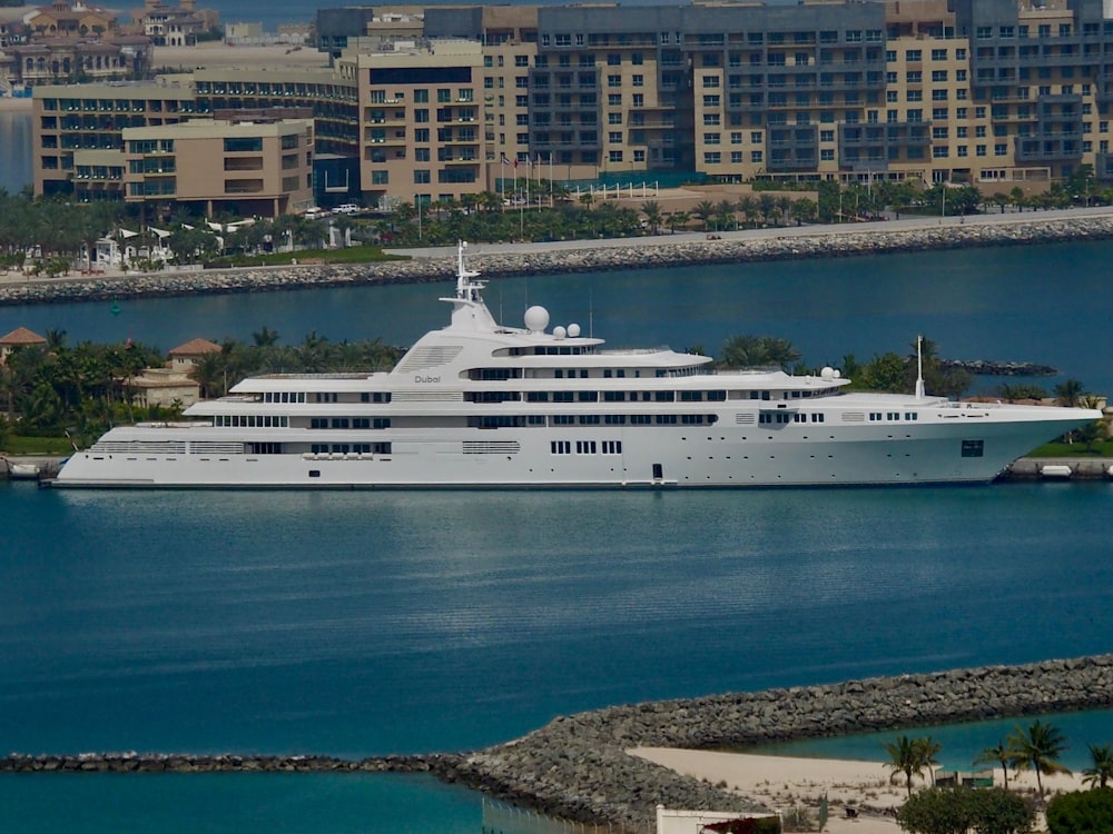 a large white boat in the middle of a body of water