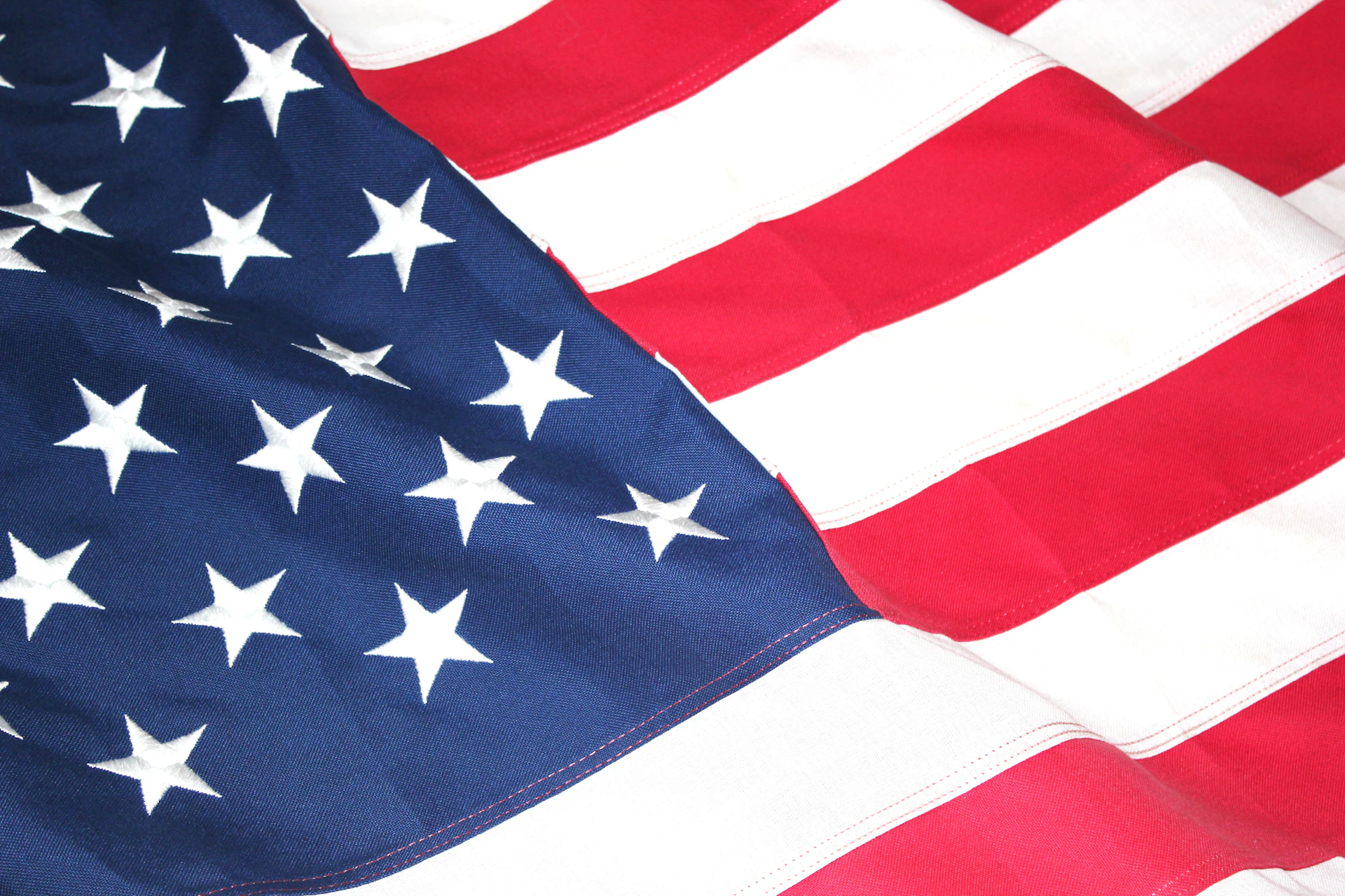 a close up of an american flag with stars on it