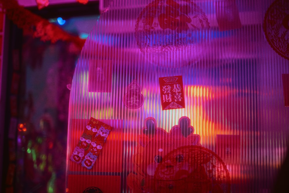 a window display with red and pink lights