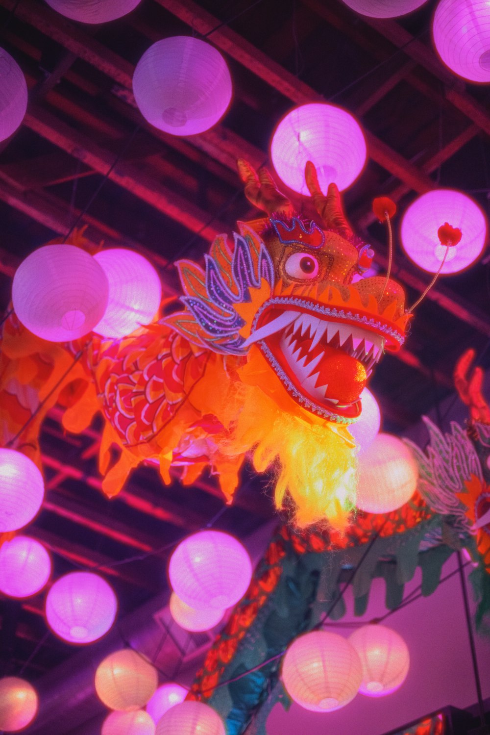 a dragon lantern is lit up in the dark