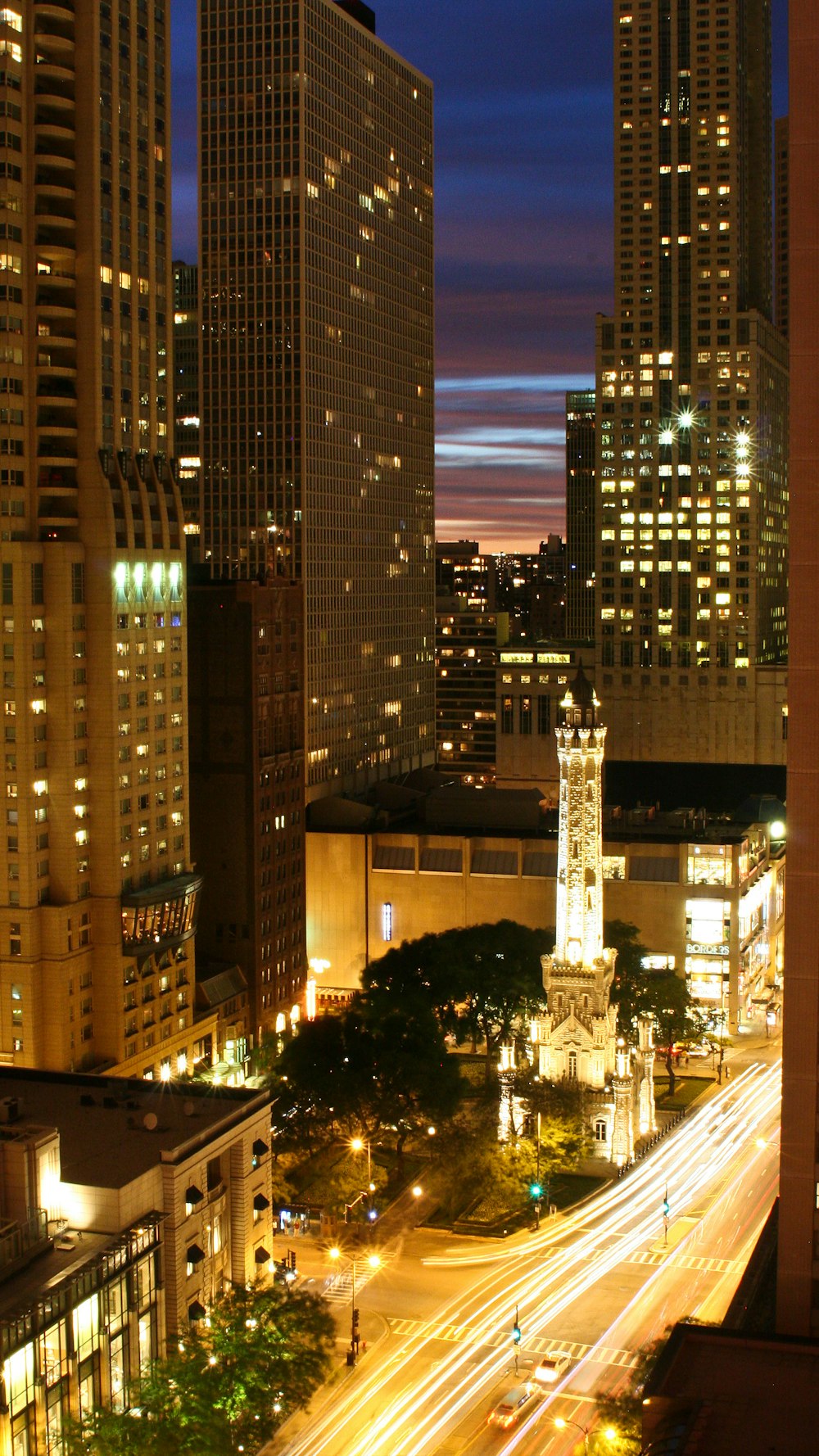 a view of a city at night from the top of a building