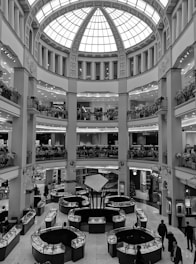 a black and white photo of a shopping mall
