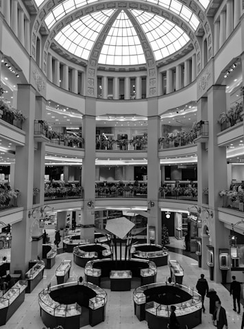 a black and white photo of a shopping mall