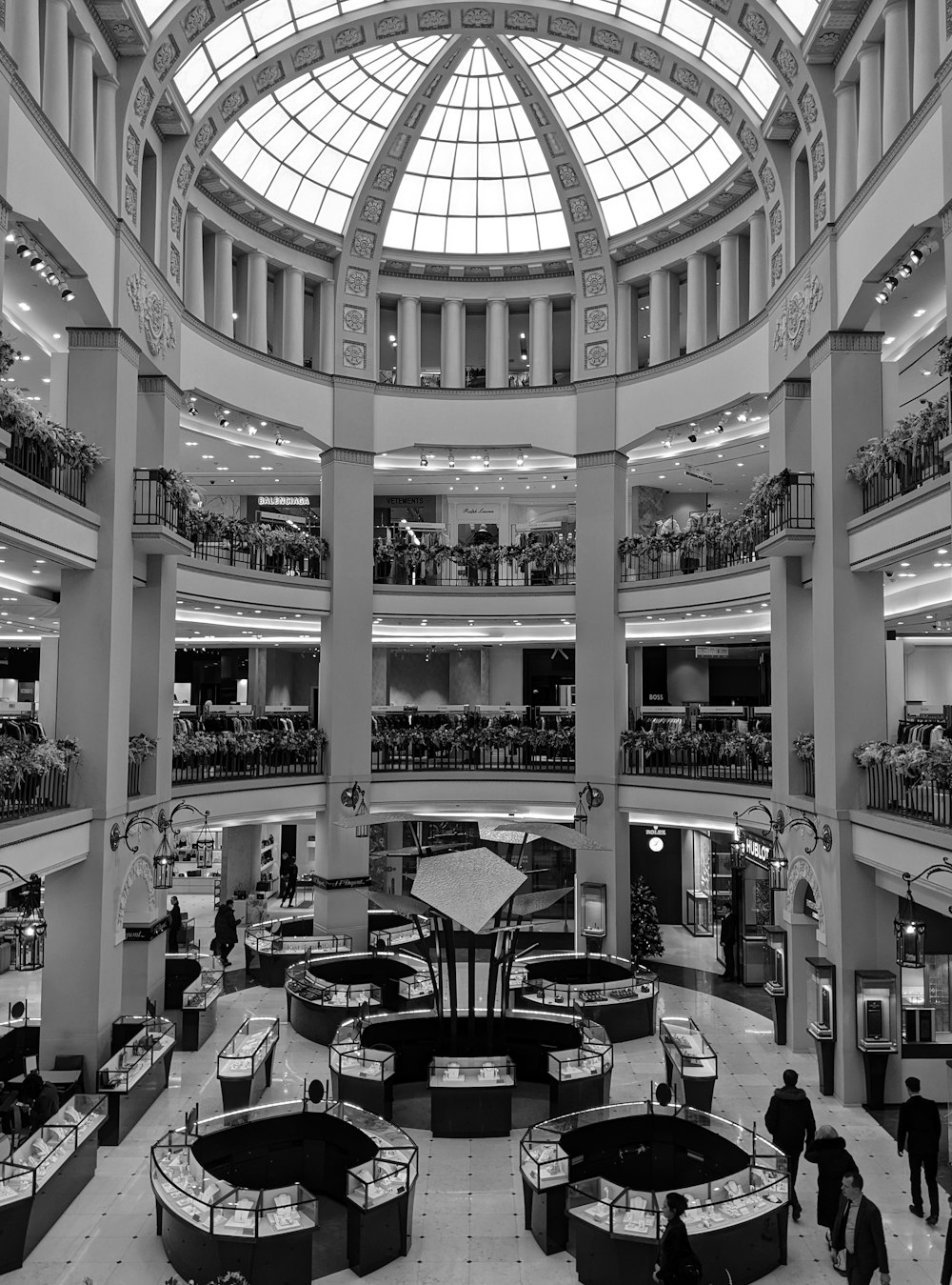 a black and white photo of a shopping mall