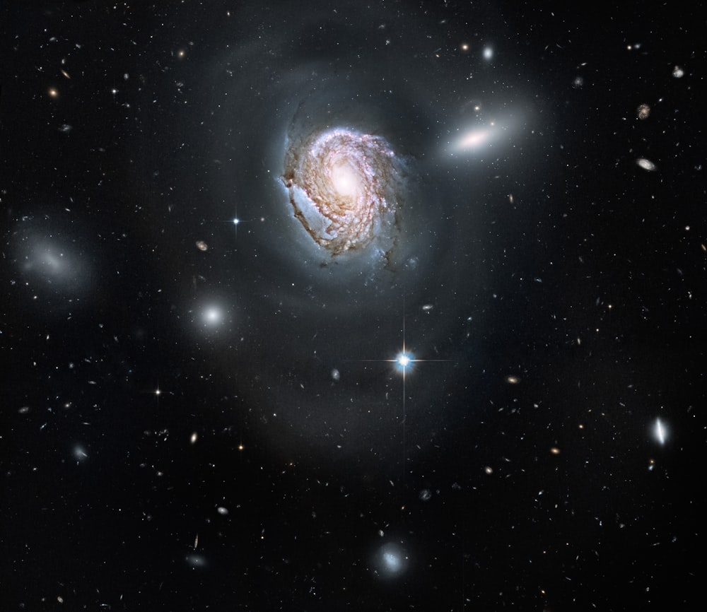 a spiral galaxy with stars in the background