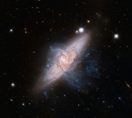 a spiral galaxy with stars in the background