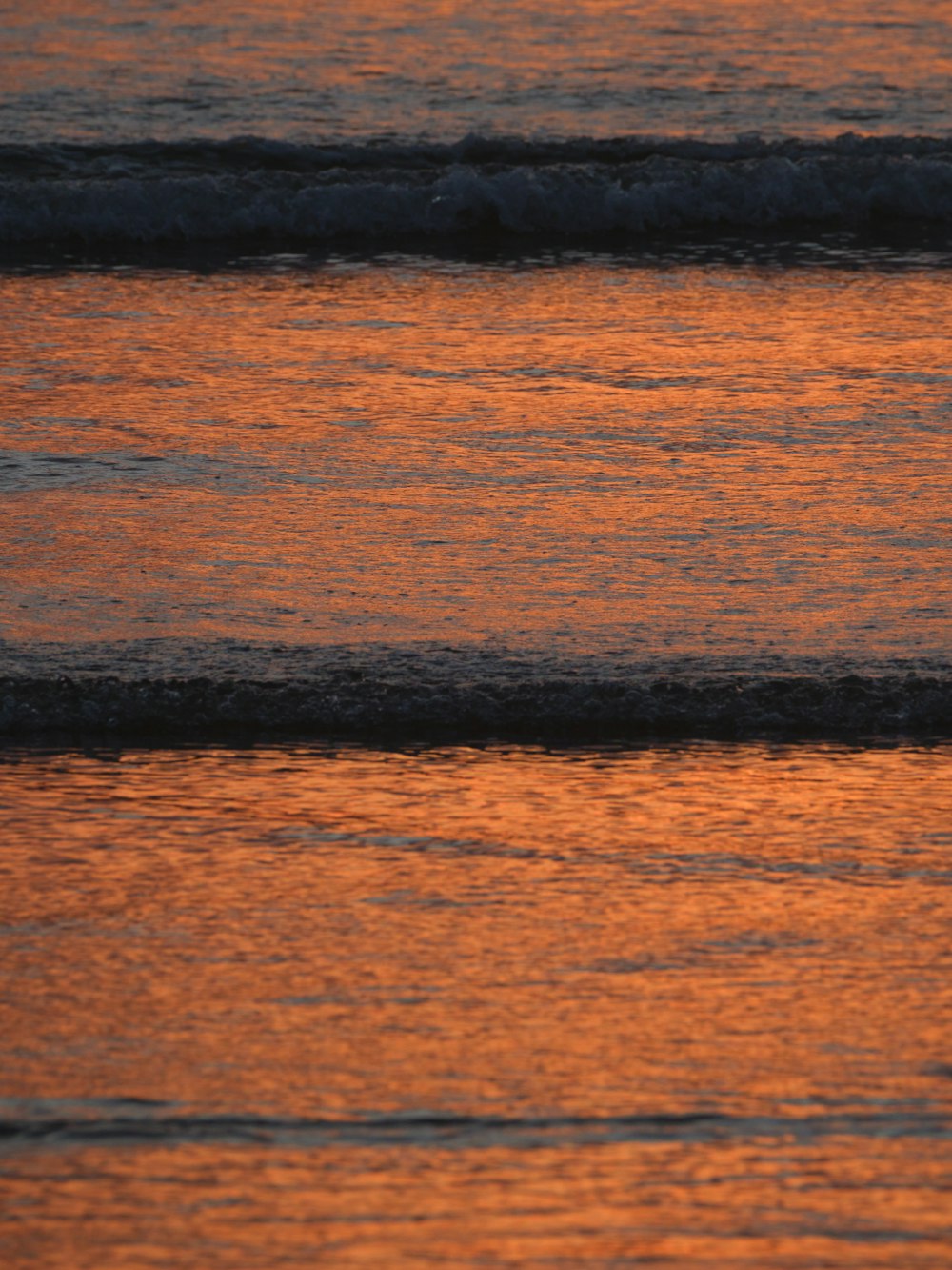 a person riding a surf board on a body of water