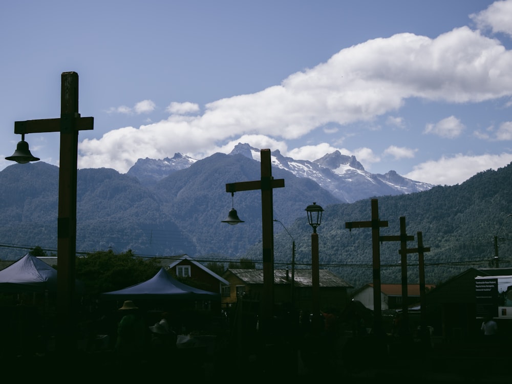 a group of crosses hanging from the side of a mountain