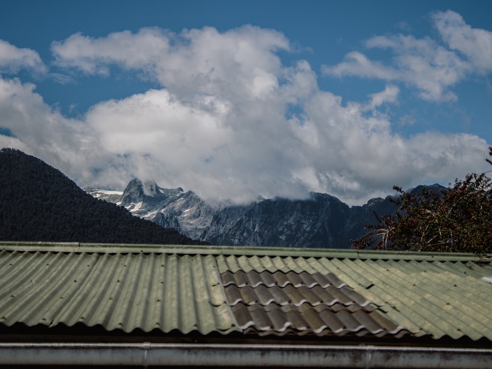 a view of a mountain range from a roof