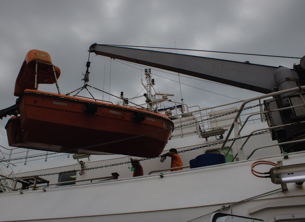 a large boat with a crane on top of it