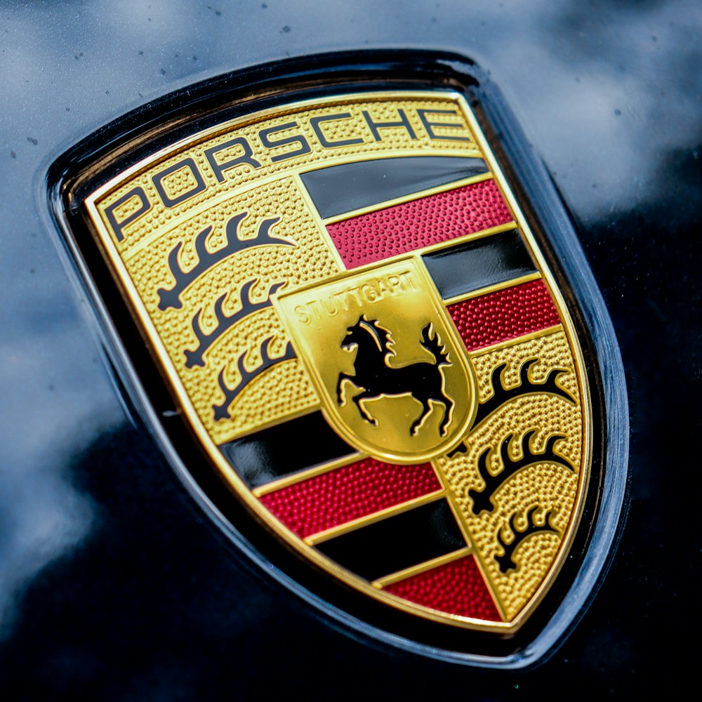 a close up of a porsche emblem on a car