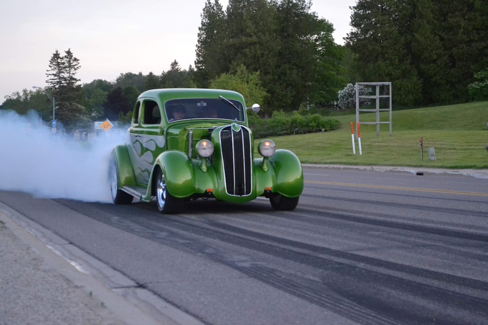 a green truck with smoke coming out of it