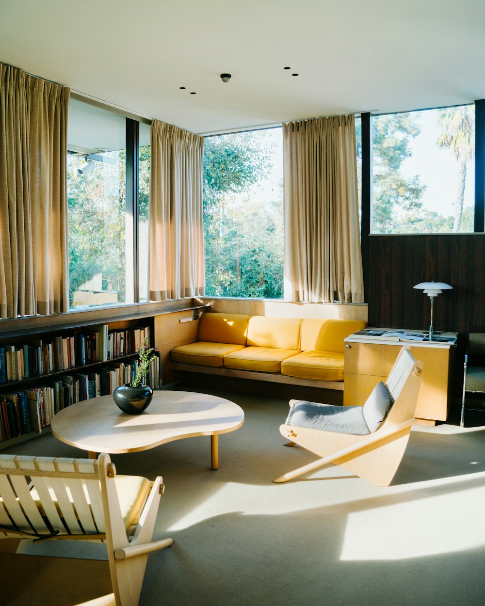 a living room filled with furniture and a large window