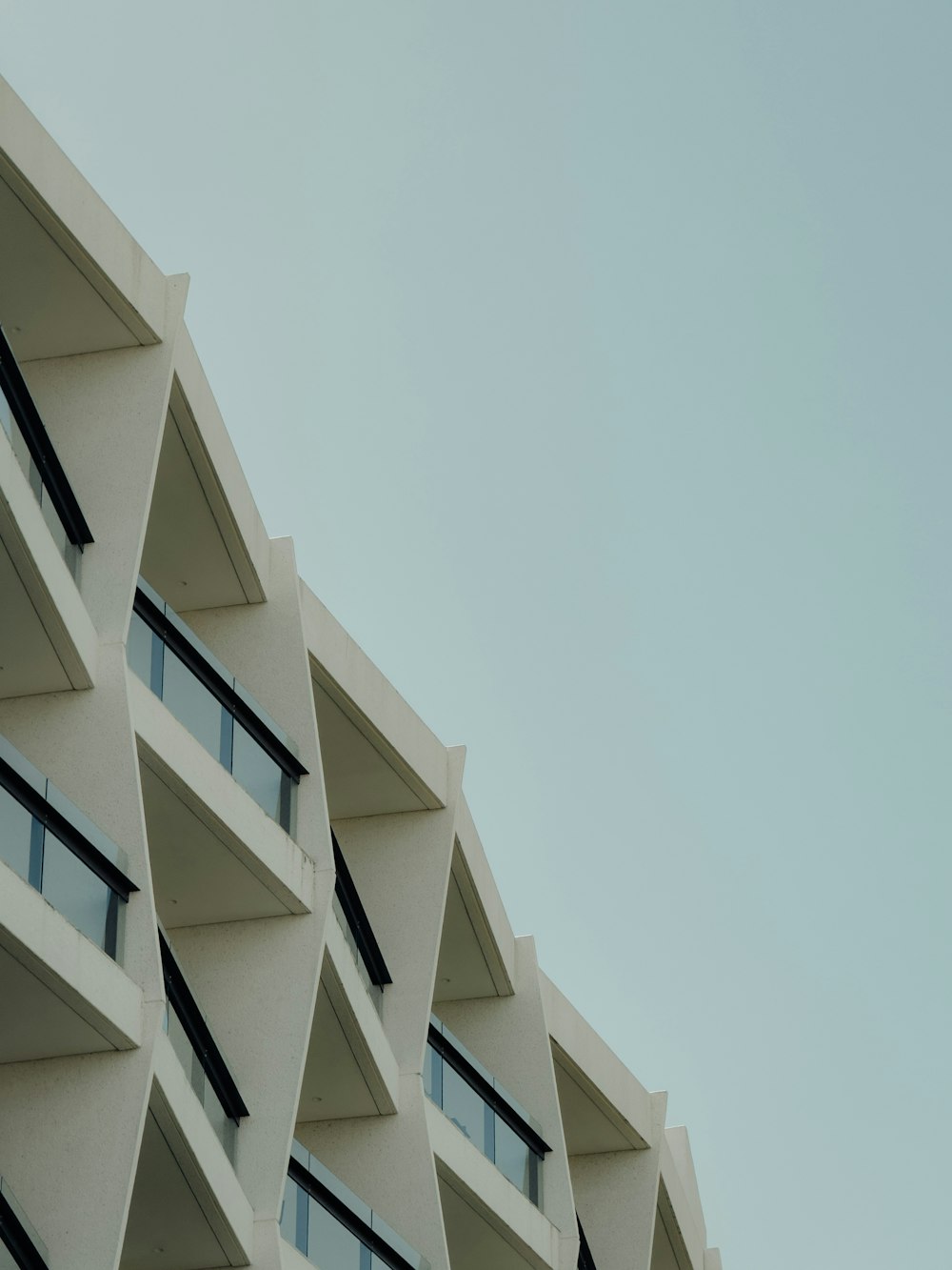 a building with multiple balconies on the side of it