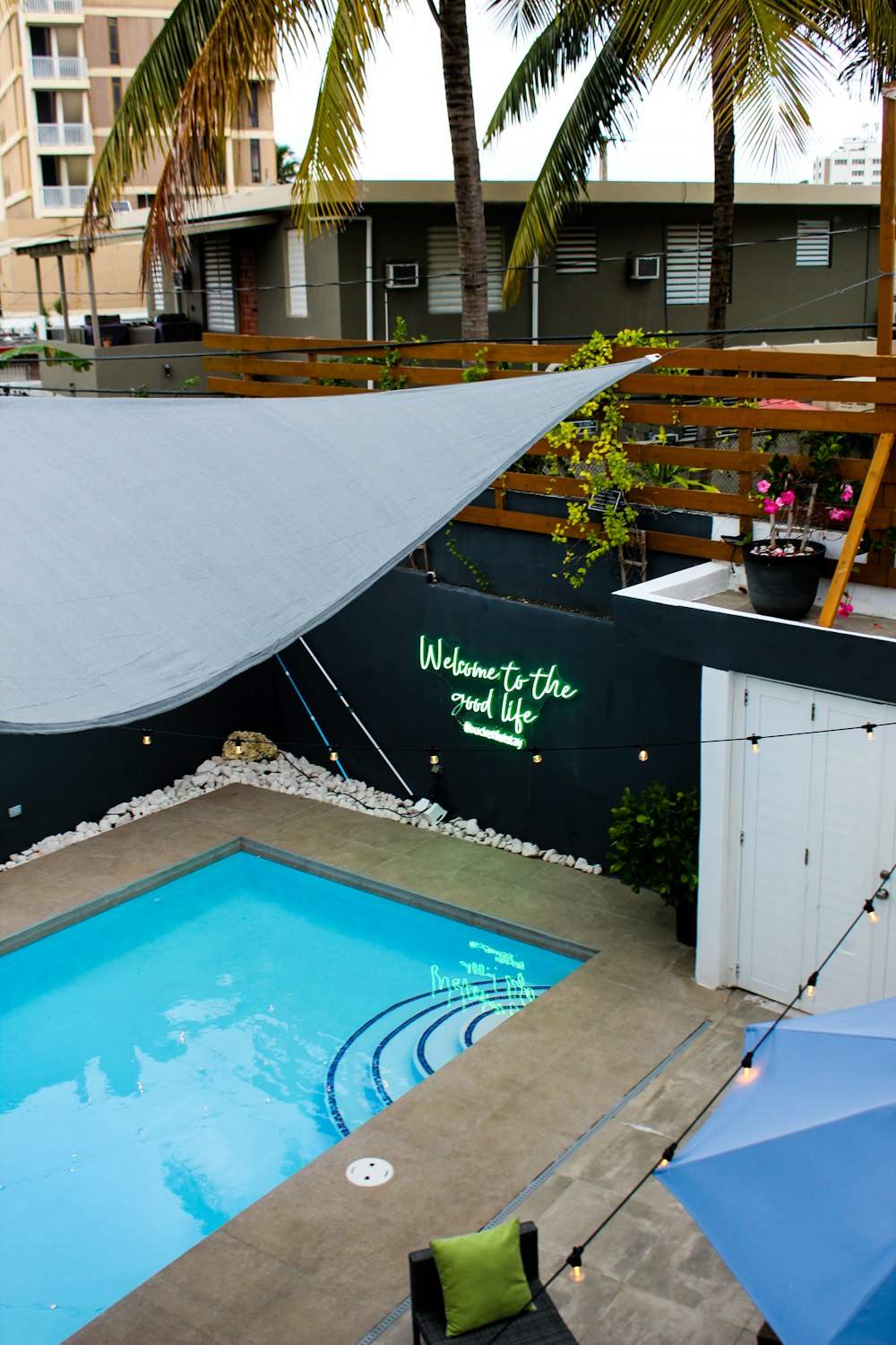 a swimming pool with a shade over it