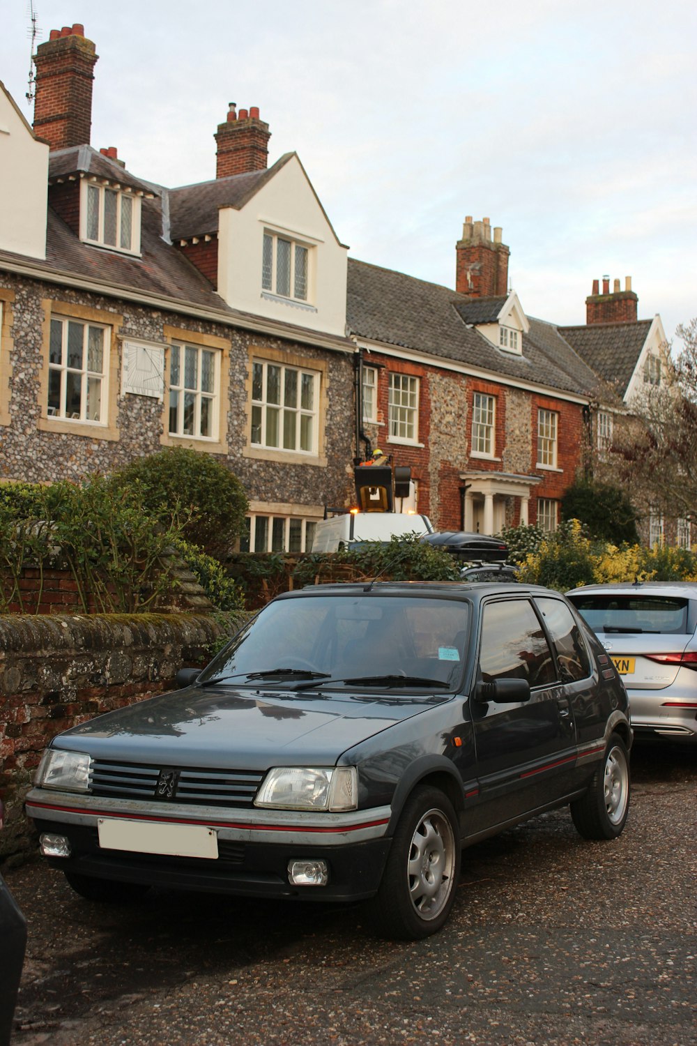 a car parked in front of a row of houses