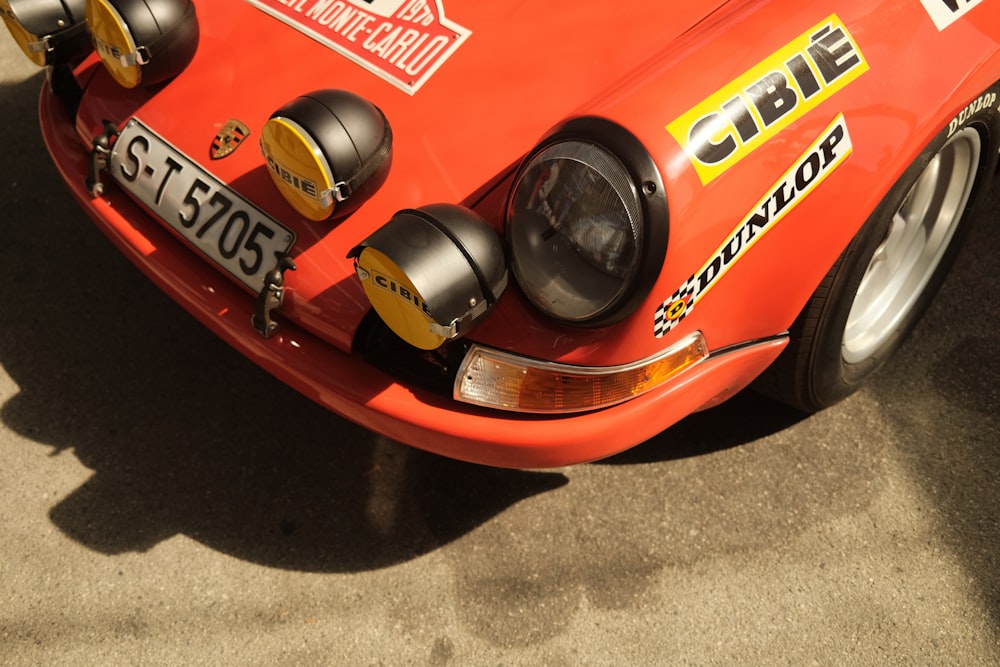 a close up of the front of a red sports car