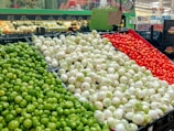 a display in a grocery store filled with lots of vegetables