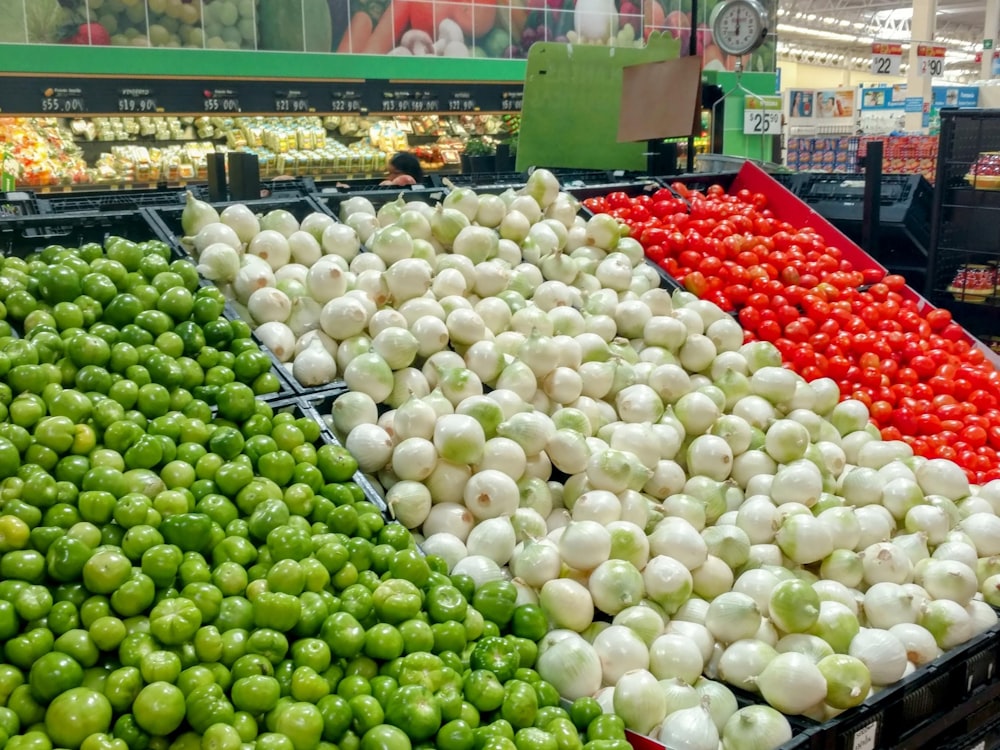 a display in a grocery store filled with lots of vegetables