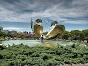 a large metal sculpture in the middle of a park