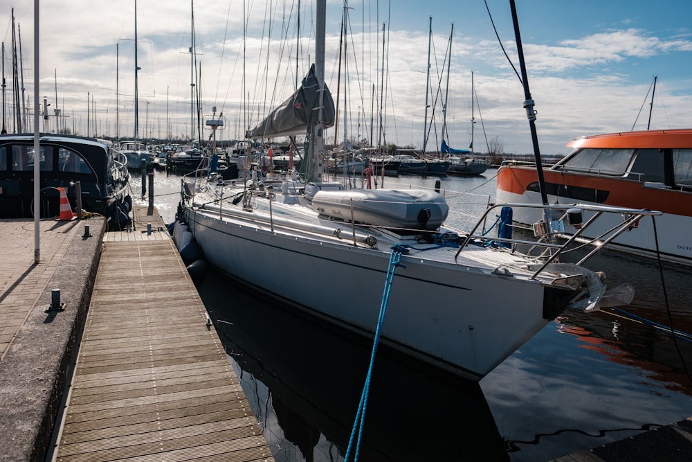 a boat docked at a dock with other boats