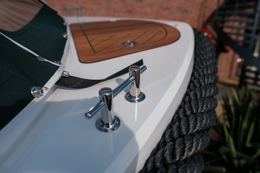 a close up of a boat with a wooden sail