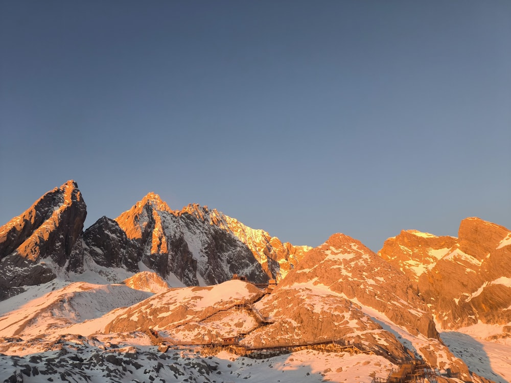 a view of a mountain range at sunset