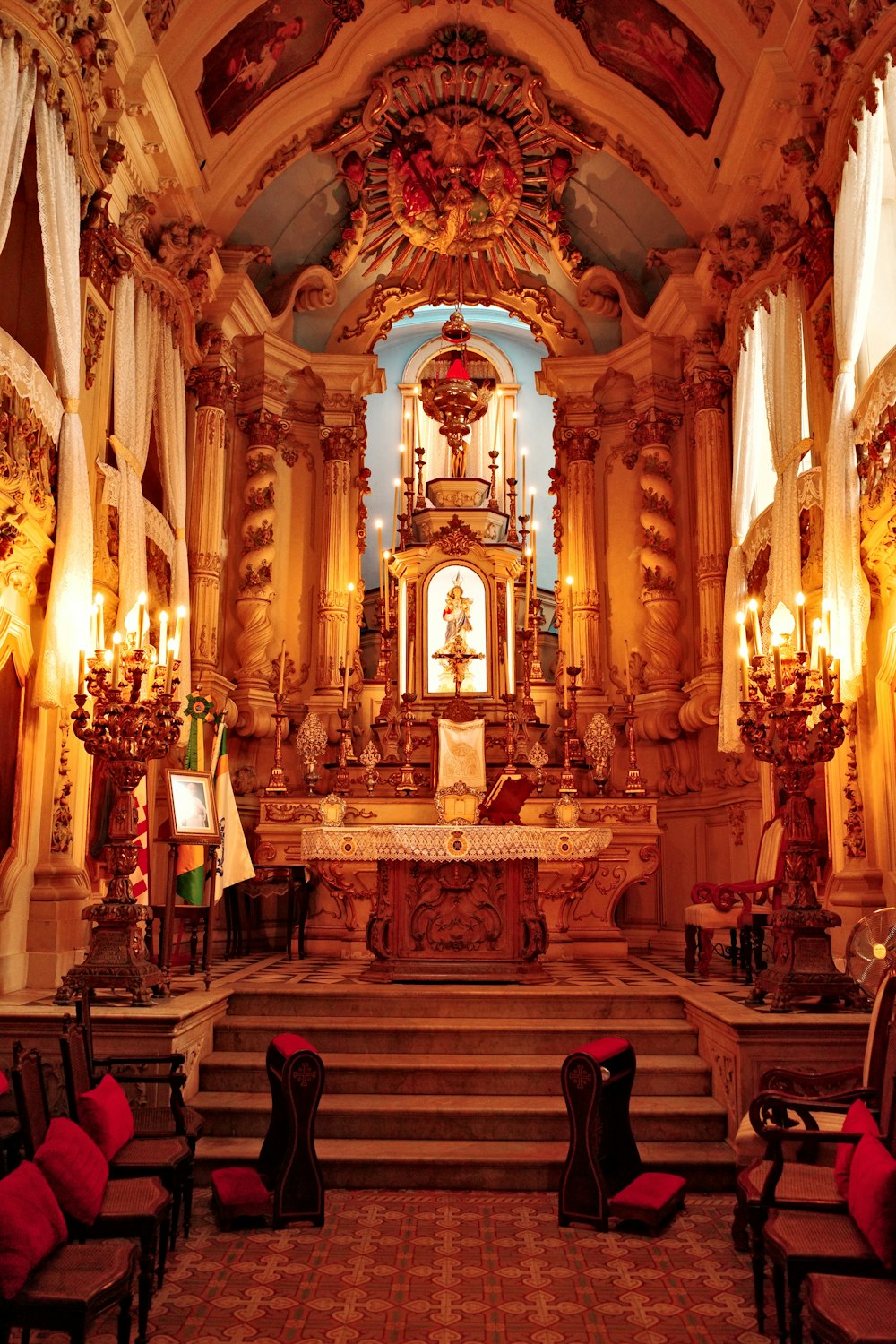 a church filled with lots of chairs and a alter