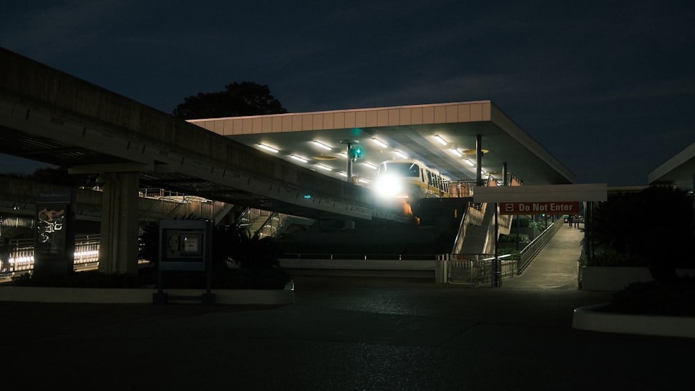 a building with a green traffic light at night