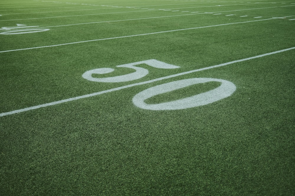 a football field with the number 50 painted on it