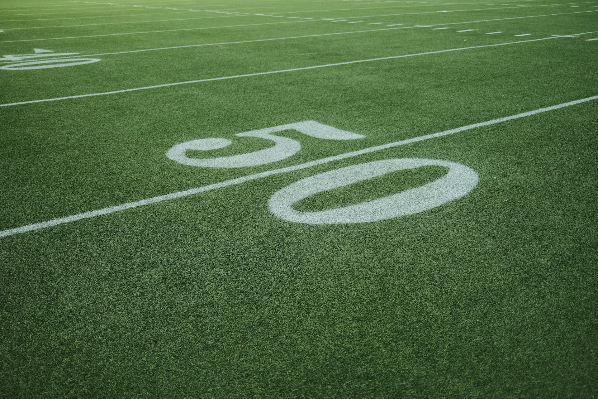 a football field with the number 50 painted on it