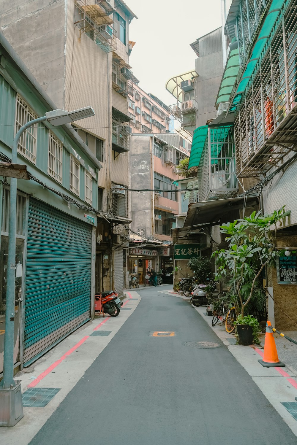 a narrow city street lined with tall buildings