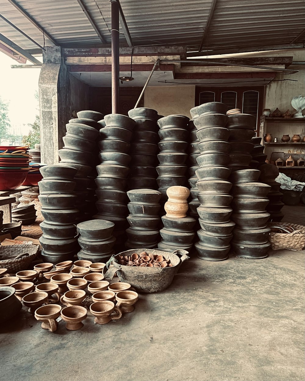 a room filled with lots of pots and bowls