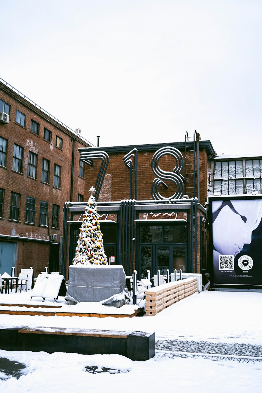 a building with a christmas tree in front of it