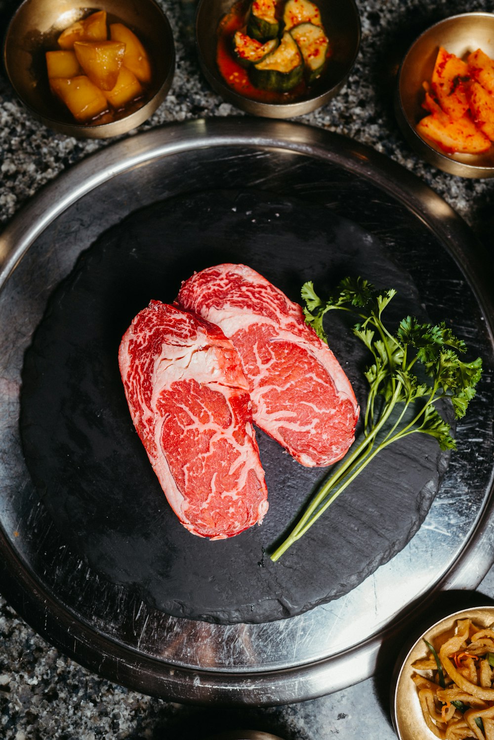 a couple of raw meat sitting on top of a pan