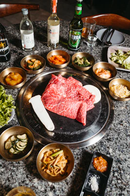 a table topped with bowls and plates of food