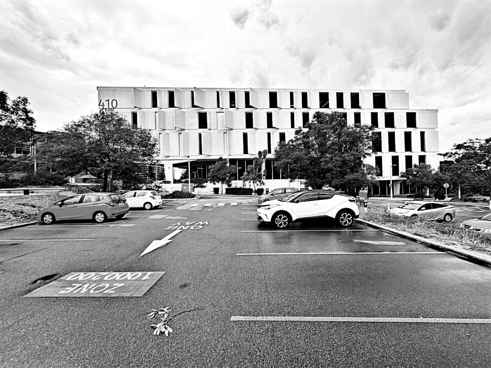 a black and white photo of a parking lot