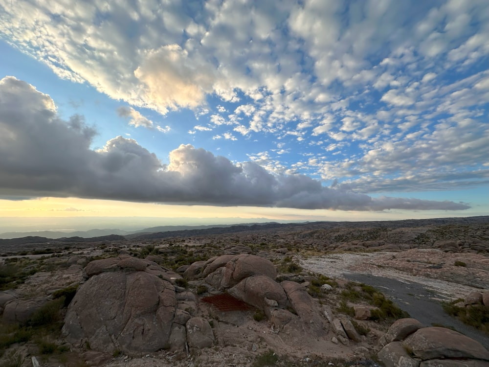 a rocky landscape with a river running through it