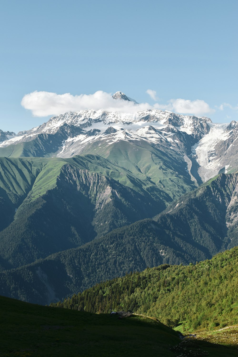 a view of a mountain range with snow on the top