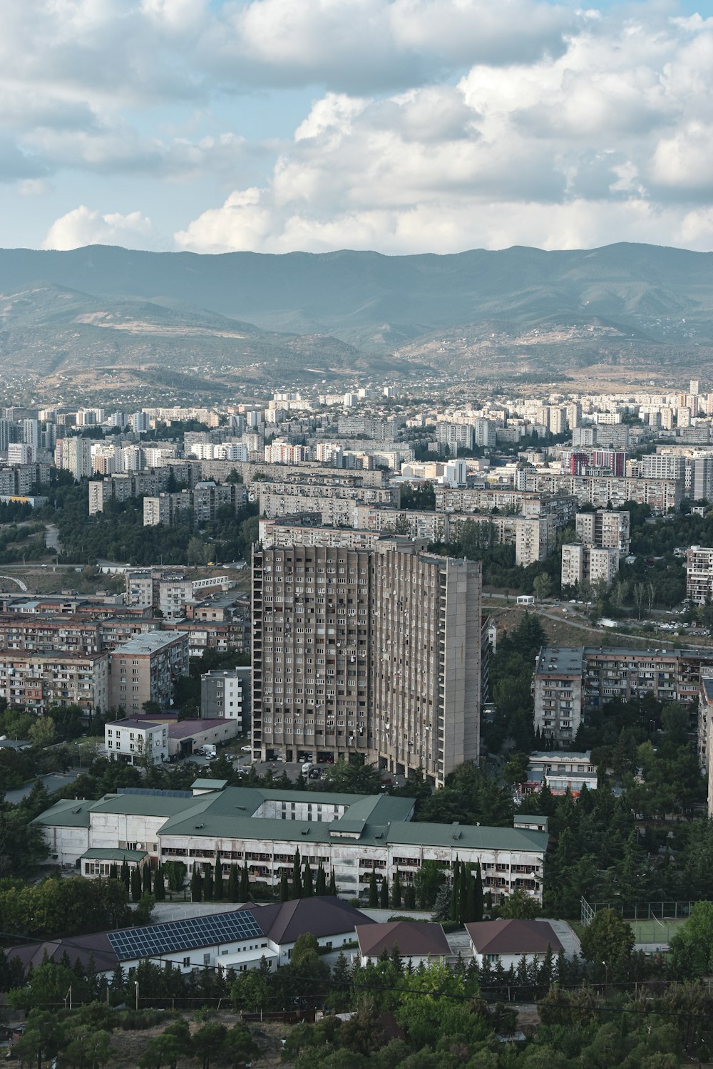 a view of a city with mountains in the background