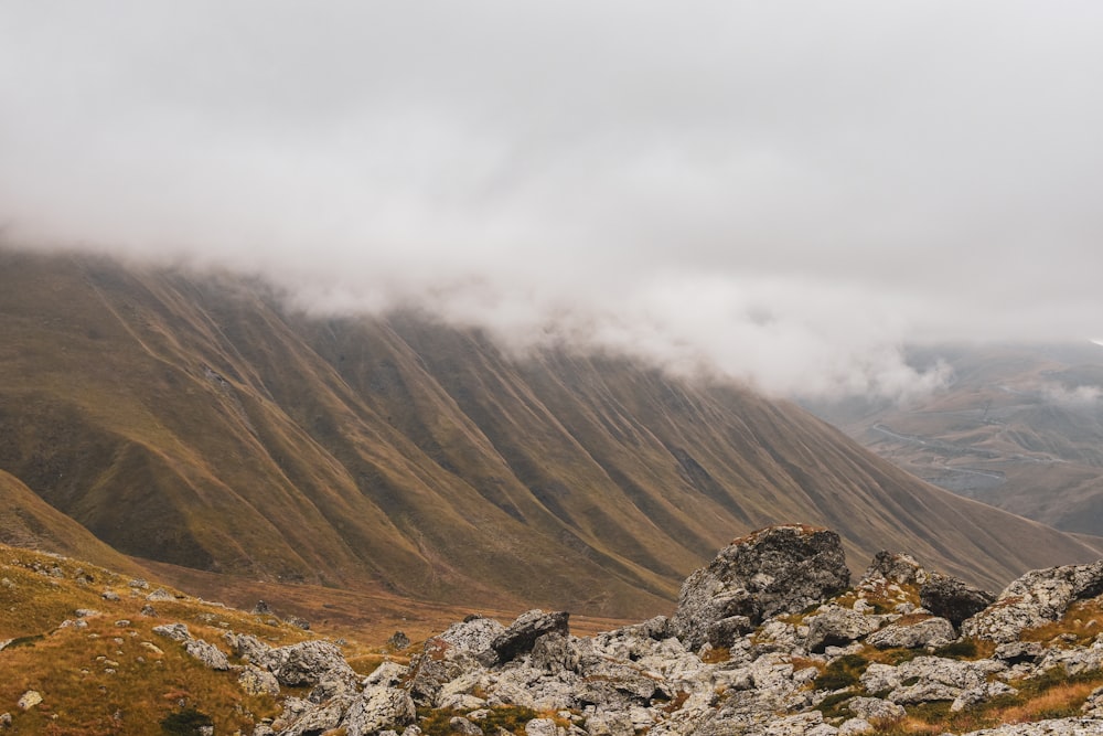 a view of a mountain range in the clouds