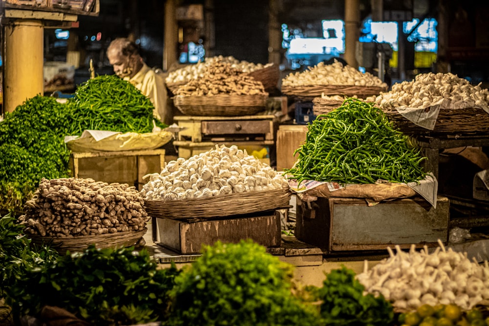 a bunch of baskets filled with lots of vegetables