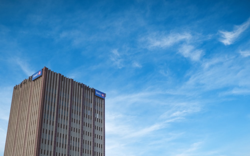 a tall building with a blue sky in the background