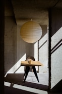 a table with a paper lantern on top of it