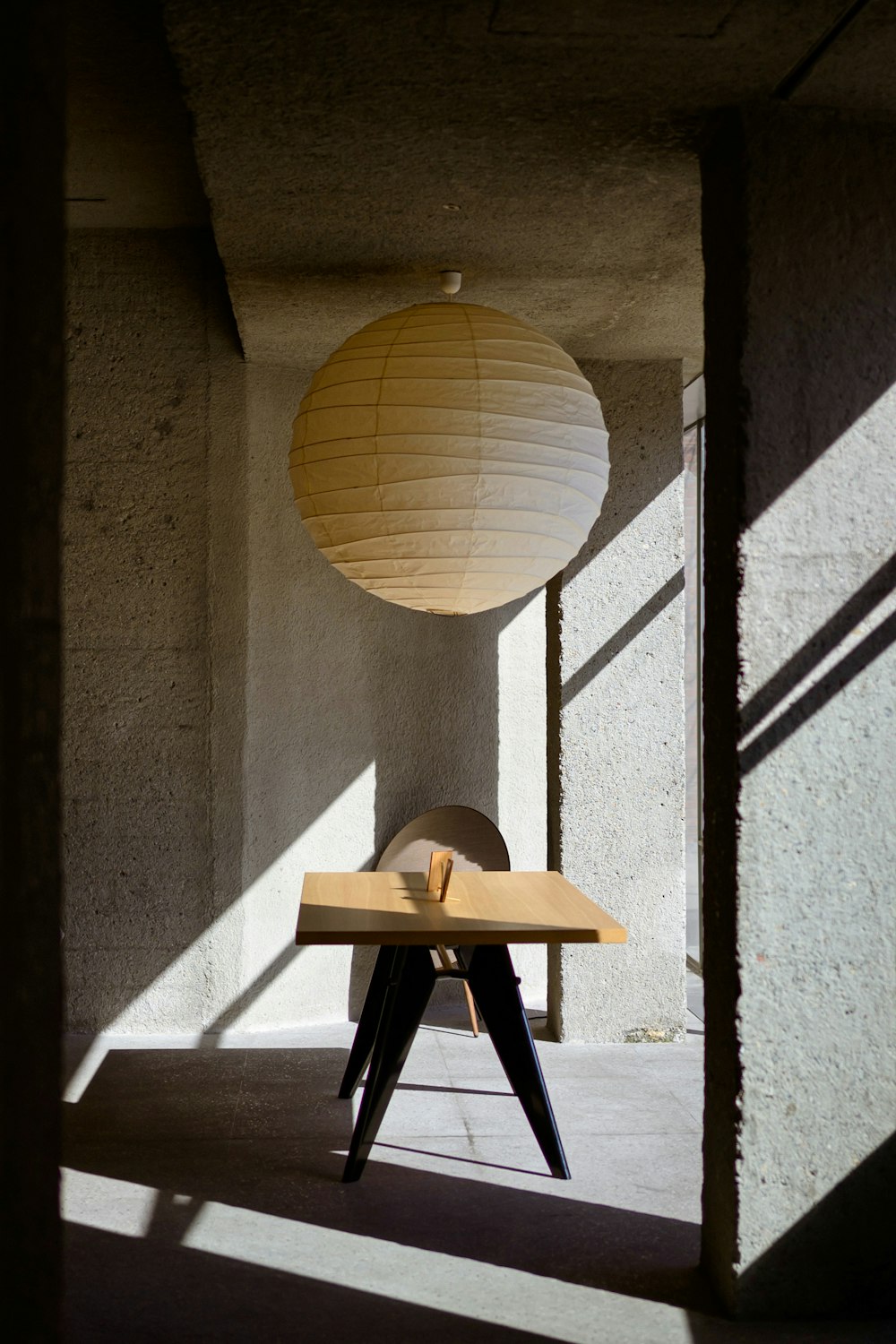 a table with a paper lantern on top of it