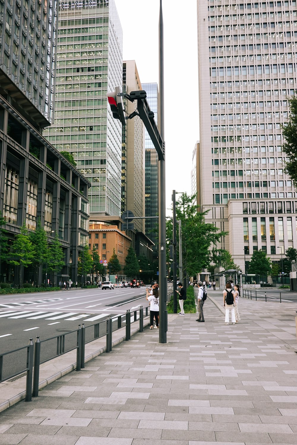 a city street with people walking on the sidewalk